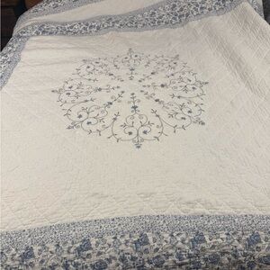 Handmade white with a detailed blue floral and vine pattern Kantha quilt king